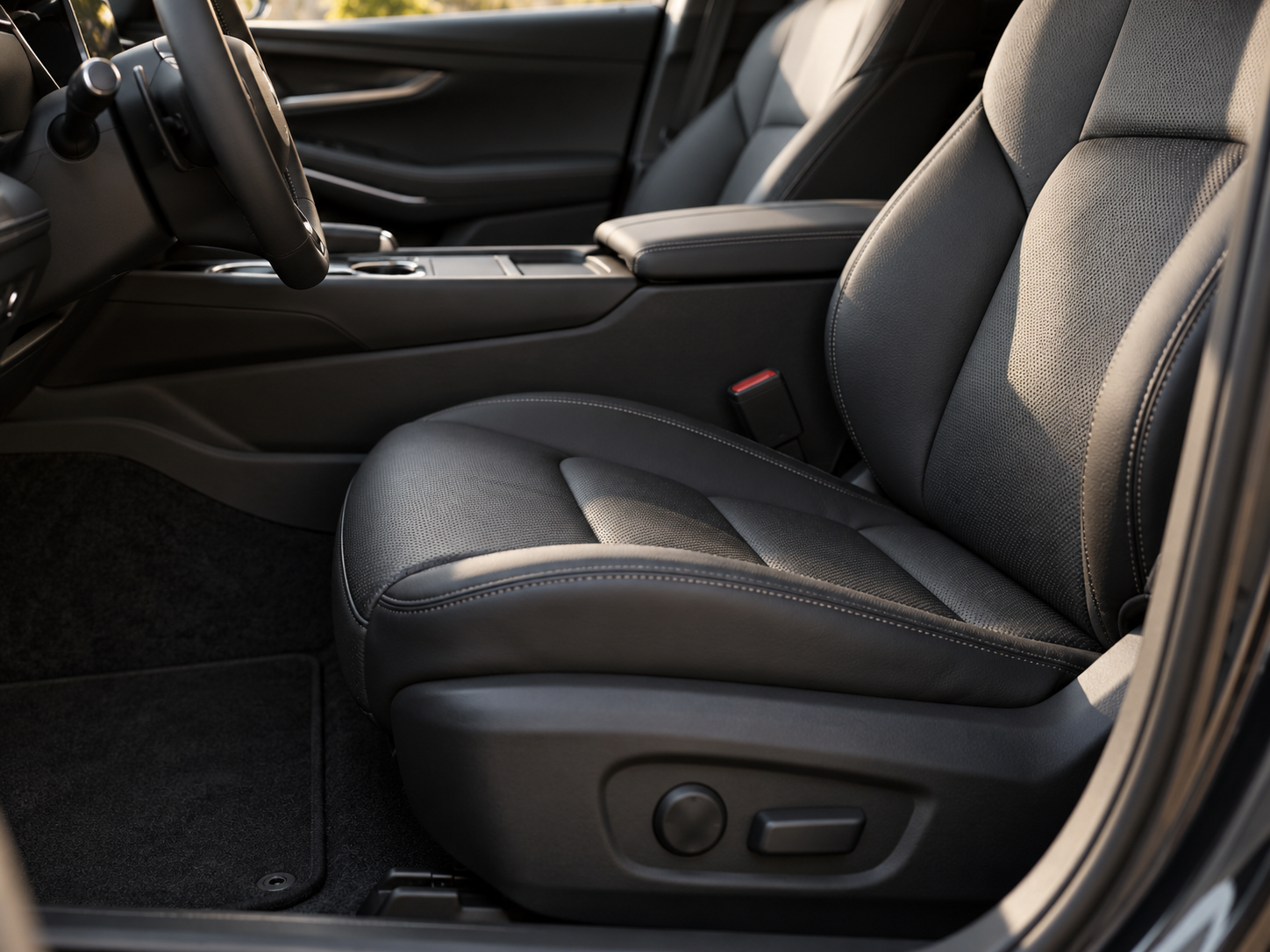Illustrative close-up of a clean dark leather vehicle interior